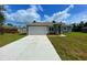 Charming single-story home with a two-car garage and well-maintained landscaping at 4437 Sw 159Th Pl, Ocala, FL 34473
