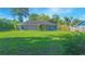 Expansive backyard with lush green grass, offering ample space for outdoor activities and relaxation at 4911 Ne 7Th St, Ocala, FL 34470