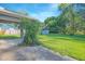 Expansive backyard with green grass and mature trees, providing a serene outdoor space at 4911 Ne 7Th St, Ocala, FL 34470