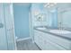 Modern bathroom featuring double sinks, updated fixtures, and a glass shower at 4911 Ne 7Th St, Ocala, FL 34470