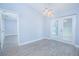 Bright dining room with double doors and modern chandelier lighting at 4911 Ne 7Th St, Ocala, FL 34470
