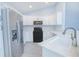 Kitchen showcasing white cabinets, stainless steel appliances, and modern countertops at 4911 Ne 7Th St, Ocala, FL 34470
