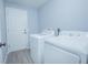 Functional laundry room with a white washer and dryer set, providing a convenient space for laundry tasks at 4911 Ne 7Th St, Ocala, FL 34470