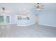 Open concept living area showcasing recessed lighting, vinyl flooring, and access to the kitchen at 4911 Ne 7Th St, Ocala, FL 34470