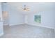 Spacious living room with light grey walls, high ceilings, vinyl plank floors, and natural light at 4911 Ne 7Th St, Ocala, FL 34470