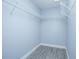 Walk-in closet featuring wire shelving and new floor at 4911 Ne 7Th St, Ocala, FL 34470