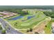 An aerial view of the golf course shows winding fairways, water features, and lush green landscaping at 561 Gunston Ct, Davenport, FL 33837