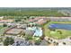 Aerial view displays the community amenities, which include the pool, playground, and tennis courts, plus parking at 561 Gunston Ct, Davenport, FL 33837