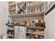 Entertain in style with this custom bar area, featuring beautiful shelving, unique glassware, and counter space at 561 Gunston Ct, Davenport, FL 33837