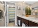 Nicely decorated bathroom with double sinks, and neutral tile flooring at 561 Gunston Ct, Davenport, FL 33837