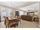 Open-concept dining area with modern furnishings, seamlessly connected to the living room at 561 Gunston Ct, Davenport, FL 33837
