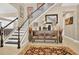 Inviting entryway with staircase, decorative furnishings, and stylish accents at 561 Gunston Ct, Davenport, FL 33837