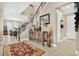 Elegant entryway featuring a staircase, decorative console table, and stylish decor at 561 Gunston Ct, Davenport, FL 33837