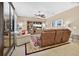 Comfortable living room with a large sectional sofa, entertainment center, and neutral color palette at 561 Gunston Ct, Davenport, FL 33837