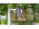 Aerial perspective of property showing driveway, roof condition and landscaping at 7330 Canal Dr, Sanford, FL 32771