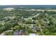 This aerial view shows the home's serene setting, surrounded by lush greenery and nearby open spaces at 7330 Canal Dr, Sanford, FL 32771