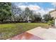 Backyard featuring a shed, patio, and well maintained lawn with perimeter fence at 7330 Canal Dr, Sanford, FL 32771