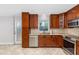 Charming kitchen featuring stainless steel appliances, granite countertops, and plentiful cabinetry at 7330 Canal Dr, Sanford, FL 32771