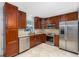 Modern kitchen featuring stainless steel appliances, granite countertops, and ample cabinet space at 7330 Canal Dr, Sanford, FL 32771
