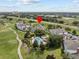 Scenic aerial view of resort-style condos, community pool, and golf course highlighting lifestyle amenities at 7615 Heritage Crossing Way # 201, Reunion, FL 34747