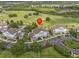 An aerial view of a community with golf courses and parking area at 7615 Heritage Crossing Way # 201, Reunion, FL 34747