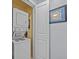 Convenient laundry room with stacked washer and dryer, perfect for easy chores at 7615 Heritage Crossing Way # 201, Reunion, FL 34747
