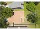 Aerial view showing roof in neighborhood with tree coverage and fenced yard at 7939 Winter Song Dr, Orlando, FL 32825