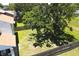 Aerial view of a home featuring a large backyard with mature trees and a wooden fence at 7939 Winter Song Dr, Orlando, FL 32825