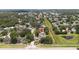 Aerial view of home in a residential neighborhood near community green space and pond at 7939 Winter Song Dr, Orlando, FL 32825