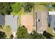 A bird's-eye view of the home showing its landscaping, roof and proximity to nearby streets and other homes at 7939 Winter Song Dr, Orlando, FL 32825