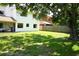 Large backyard with a patio, wooden fence and mature trees at 7939 Winter Song Dr, Orlando, FL 32825