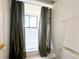 Bathroom with a shower and olive green curtain at 7939 Winter Song Dr, Orlando, FL 32825