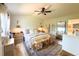 Bright bedroom featuring a comfortable bed, stylish decor, and hardwood floors, creating a welcoming retreat at 7939 Winter Song Dr, Orlando, FL 32825