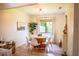 Cozy dining room features a round table, modern chairs, and a large window at 7939 Winter Song Dr, Orlando, FL 32825