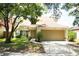Charming single-Gathering home with a well-manicured lawn and a two-car garage at 7939 Winter Song Dr, Orlando, FL 32825