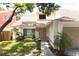 Inviting front entrance with walkway, small palms, and manicured landscaping at 7939 Winter Song Dr, Orlando, FL 32825