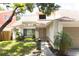 Inviting home entrance featuring a covered porch and attractive landscaping at 7939 Winter Song Dr, Orlando, FL 32825