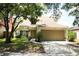 Charming two-story home with attached two-car garage and well-maintained lawn at 7939 Winter Song Dr, Orlando, FL 32825