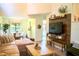 Bright living room with modern built-ins, comfortable seating, and lots of natural light at 7939 Winter Song Dr, Orlando, FL 32825