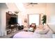 Bright living space featuring a vaulted ceiling, media center wall and neutral tones for versatile décor at 7939 Winter Song Dr, Orlando, FL 32825