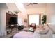 Spacious living room with vaulted ceiling, large windows, and modern decor at 7939 Winter Song Dr, Orlando, FL 32825