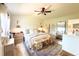 Serene bedroom featuring light wood floors, neutral tones and ample space, offering a calm retreat at 7939 Winter Song Dr, Orlando, FL 32825