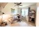 Bright office space with a large window, crafting table, and ample storage for an organized workspace at 7939 Winter Song Dr, Orlando, FL 32825