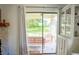 View to outdoor patio with comfortable seating area accessible through sliding glass doors at 7939 Winter Song Dr, Orlando, FL 32825