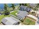 Aerial view showcasing the home, its backyard, proximity to the lake, and neighborhood setting at 840 Bethune Dr, Orlando, FL 32810