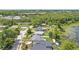 Aerial view showcasing the tranquil neighborhood, with lush trees and a peaceful lake, creating a serene residential setting at 840 Bethune Dr, Orlando, FL 32810