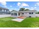 Backyard featuring a wood deck, a putting green, lush grass and lake access at 840 Bethune Dr, Orlando, FL 32810