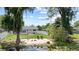 Backyard featuring a sandy beach, chairs and lake access at 840 Bethune Dr, Orlando, FL 32810
