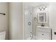 Bathroom features a glass-enclosed shower with white tile surround and a modern vanity at 840 Bethune Dr, Orlando, FL 32810