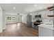 Open-concept kitchen features stainless steel appliances and light gray cabinets with quartz countertops at 840 Bethune Dr, Orlando, FL 32810